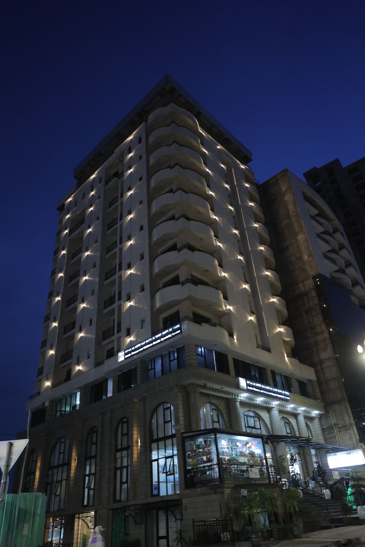 Dinapoli Hotel building in Piassa at night