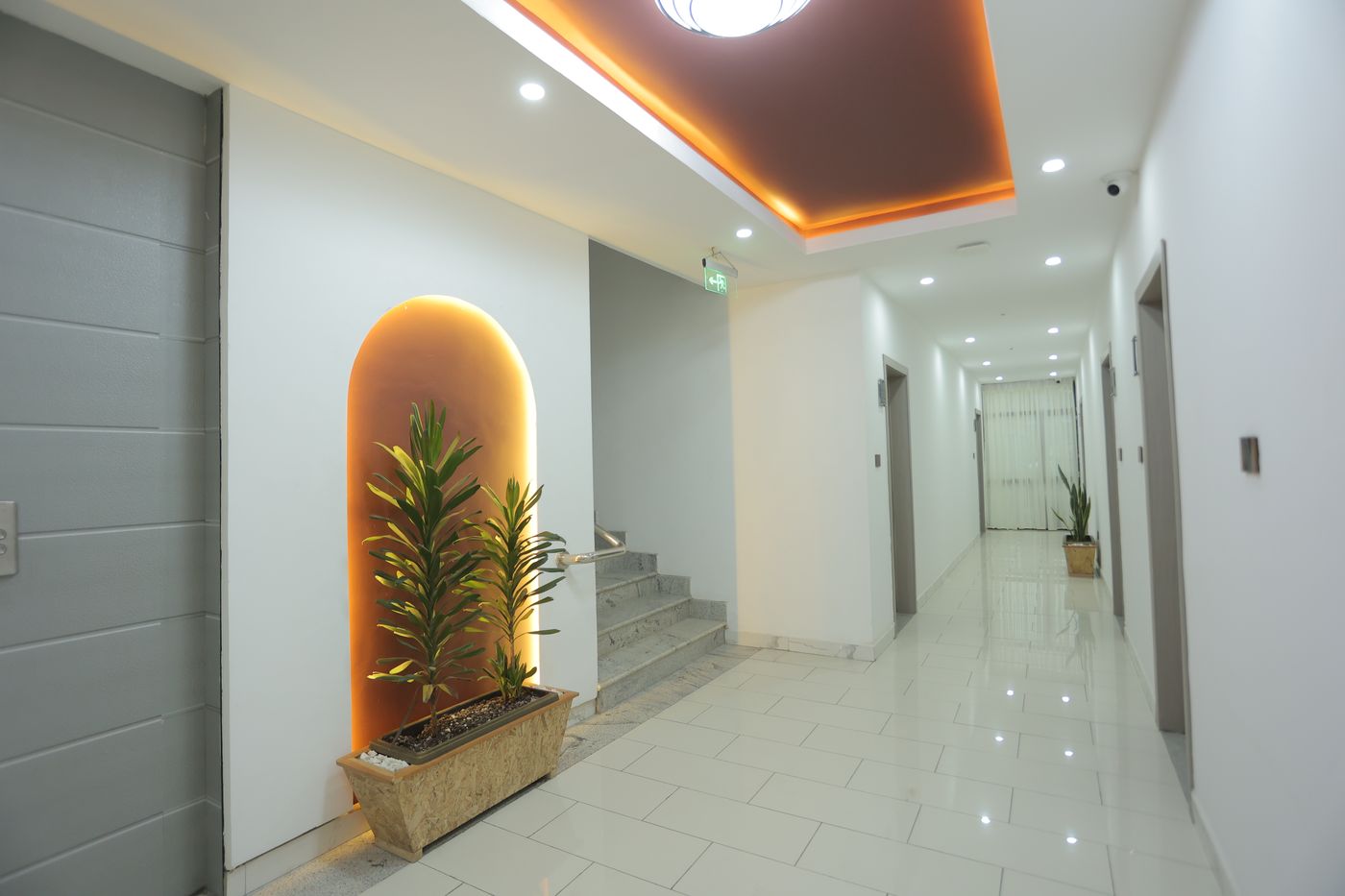 Softly lit corridor at Dinapoli Hotel, Piassa